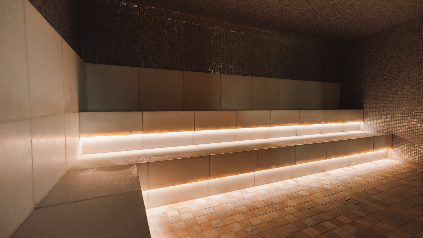 The steam room at EQ, lit low and warm