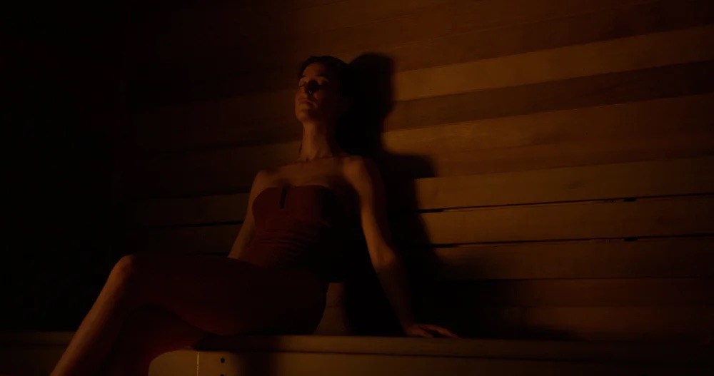 A guest sitting at ease in the EQ sauna